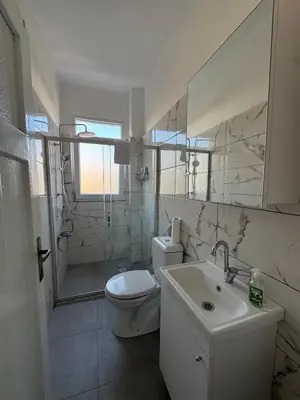 a bathroom with a toilet and a sink and a shower at The Kinyas House - Apartment in Kadıköy Historical Fishermen's Market in Istanbul