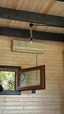 a ceiling with a light and a mirror in a room at Karahan bungalov in Tayakadın