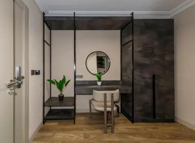 a dressing room with a mirror and a chair at Çorlu Temel Hotel in Corlu