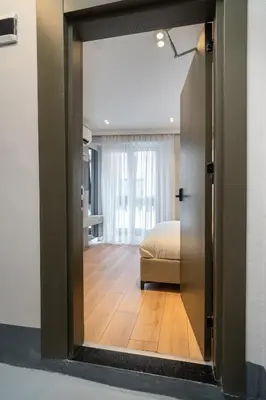 a room with a door leading to a bedroom at Pia Global - Nevizade in Istanbul
