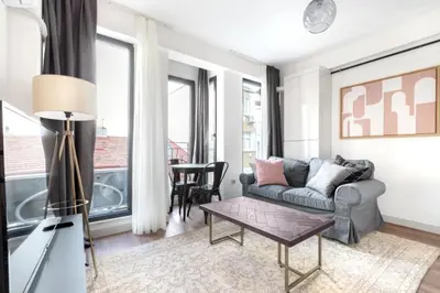 a living room with a couch and a table at Elegant & Charming Apartment in Beyoglu in Istanbul