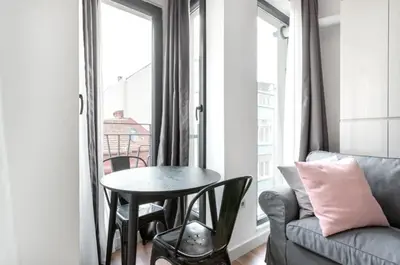 a living room with a table and a couch at Elegant & Charming Apartment in Beyoglu in Istanbul