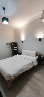 a bedroom with a large bed with white sheets at Şişli Suites - Room22 in Istanbul