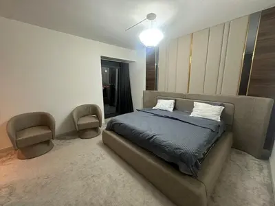 a bedroom with a bed and a couch at Luxury family-balcony apt in Istanbul