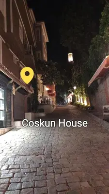 a yellow frisbee flying over a brick road at night at Coskun apt in Istanbul