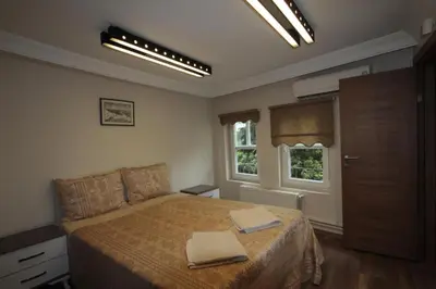 a bedroom with a bed with two towels on it at Coskun apt in Istanbul