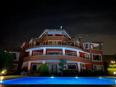 a large building with a pool in front of it at Luxury Mansion Amazing View, Hidden Garden in Celâliye