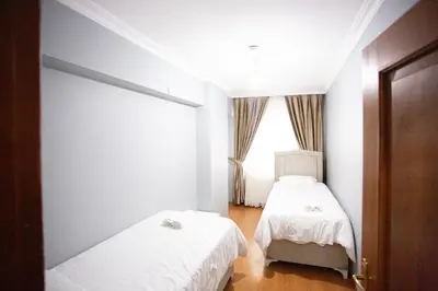 a bedroom with two beds and a window at Nomadia turkey in Istanbul