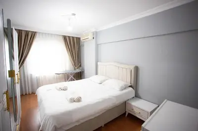 a bedroom with a bed with two towels on it at Nomadia turkey in Istanbul