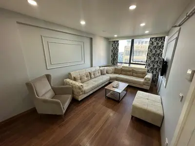 a living room with a couch and a table at Gold Suit in Istanbul