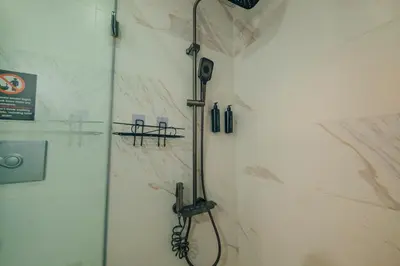 a shower in a bathroom with a glass door at tetova in Sapanca