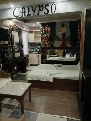 a large room with a bed and a mirror at Sword Hotel in Avcılar