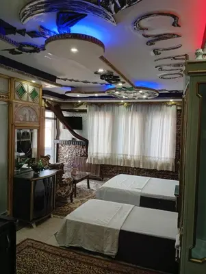 a hotel room with two beds and a television at Sword Hotel in Avcılar