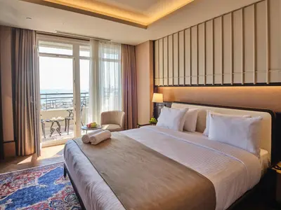 a hotel room with a large bed and a large window at Four-G Hotel Premium in Istanbul