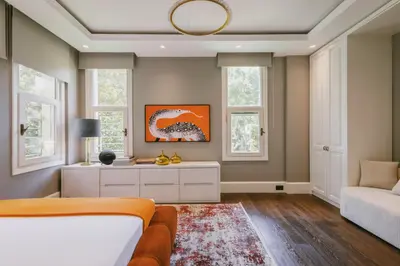 a bedroom with a bed and a couch and windows at Eva Bosphora Waterfront Living in Istanbul