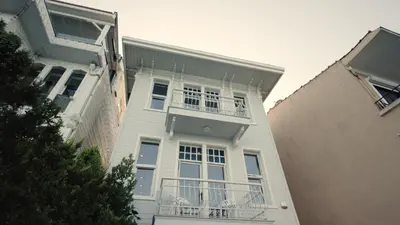 a white building with balconies on the side of it at Eva Bosphora Waterfront Living in Istanbul
