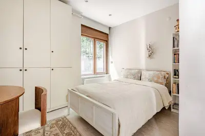 a bedroom with a bed and a desk and a window at Luxury Seaside Apartment with Bosphorus View in Sarıyer in Sarıyer