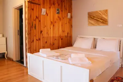 a bedroom with a white bed with towels on it at Mints Hotel Ağva in Agva