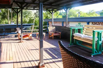a deck with benches and a table and chairs at Mints Hotel Ağva in Agva