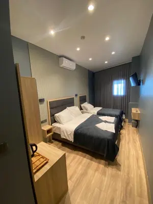 a bedroom with a bed and a television in it at iskele rum butik otel in Tekirdag