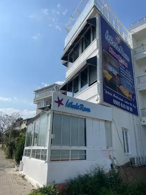 a building with a sign on the side of it at iskele rum butik otel in Tekirdag