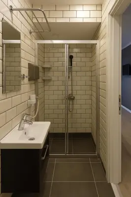 a bathroom with a sink and a shower at Utarit Hotel in Istanbul