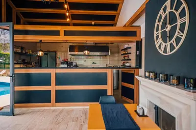 a living room with a bar and a pool at Sapanca Cayir Cimen Otel in Sapanca
