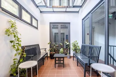 a balcony with benches and tables and plants at Cool Charming Central 1BD1Bath Modern Home! #398 in Istanbul