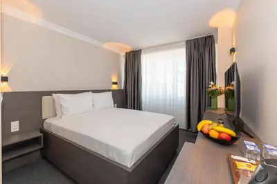 a hotel room with a bed and fruit on the floor at Mays Otel in Istanbul
