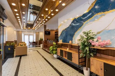 a lobby with a large painting on the wall at Mays Otel in Istanbul