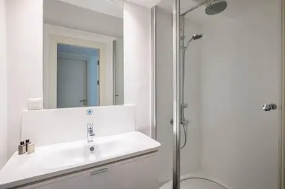 a bathroom with a sink and a mirror at Cozy Coastal Hideaway with Bosphorus Breeze! #399 in Istanbul