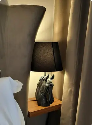 a lamp on a night stand next to a bed at Taksim The 360 Hearth Of İstanbul 55-56 in Istanbul