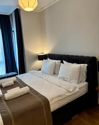 a bedroom with a large bed with white sheets and pillows at Taksim The 360 Hearth Of İstanbul 55-56 in Istanbul