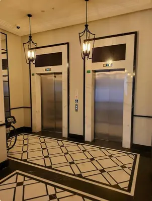 three elevators in a building with doors and lights at Taksim The 360 Hearth Of İstanbul 55-56 in Istanbul