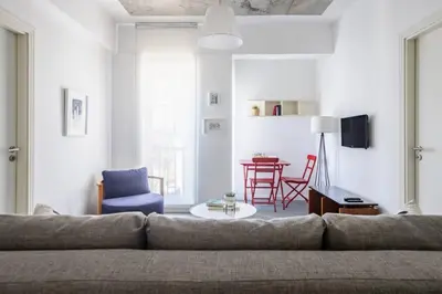 a living room with a couch and a table at Stunning Serene 2BD1Bath Bosphorus Retreat! #400 in Istanbul