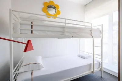 a white bunk bed in a white room with a lamp at Stunning Serene 2BD1Bath Bosphorus Retreat! #400 in Istanbul