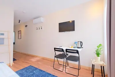 a living room with two chairs and a table at Casa Nozze 2 in Istanbul