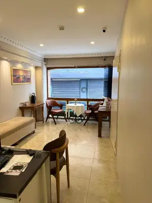 a living room with a couch and a table at Blue Istanbul Hotel Taksim in Istanbul