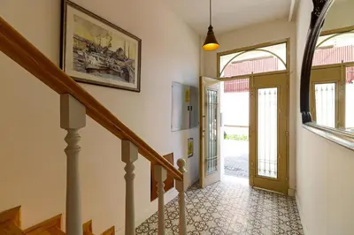 a hallway with a staircase with a door and a stairwayngthngthngthngth at Balatella Suites in Istanbul