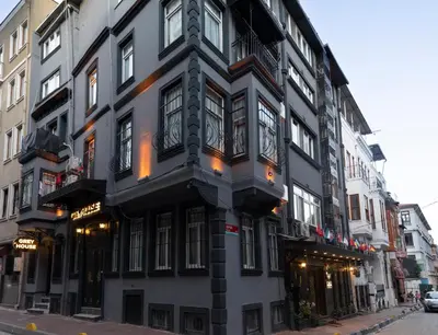 a black and white building on a city street at Grey House Apartments B Block in Istanbul