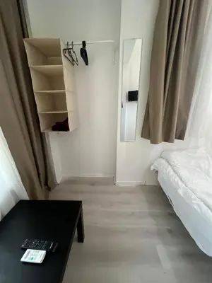 a small room with a bed and a table at Şişli Suites - Room32 in Istanbul