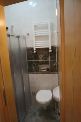 a small bathroom with a toilet and a sink at 3 Floor History Mansion in Istanbul