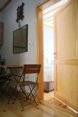 a room with a table and chairs and a door at 3 Floor History Mansion in Istanbul