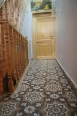 a hallway with a door and a tile floor at 3 Floor History Mansion in Istanbul
