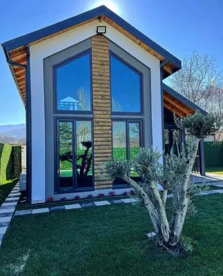 a small house with a large window at Deep Luxury Sapanca in Sapanca