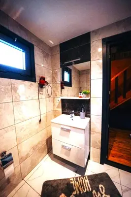 a bathroom with a sink and a mirror at Deep Luxury Sapanca in Sapanca