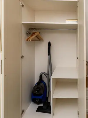 a room with a vacuum cleaner in a closet at sevim suites Nişantaşı Rumeli in Istanbul