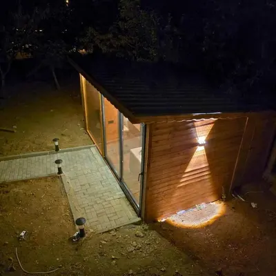 a small bird house with a light on it at night at Uludag Zirve Garden - BBQ Jacuzzi