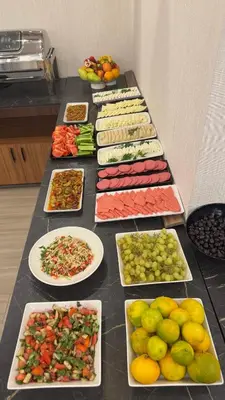 a table full of different types of vegetables and fruits at Gnc Airport Hotel in Arnavutköy