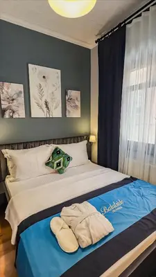 a bedroom with a bed with towels on it at Balat Side Apart in Istanbul